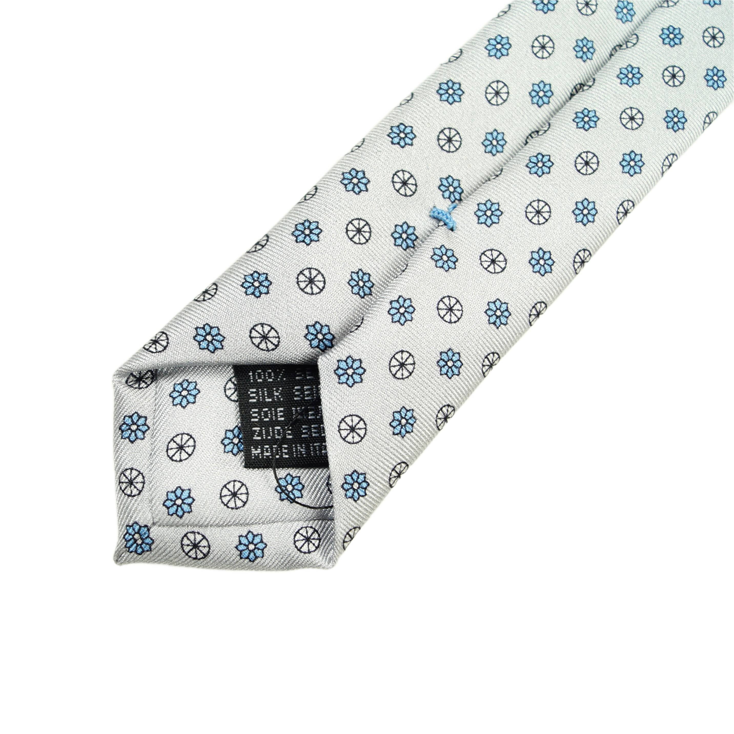 Ice white tie with small medallions in light blue